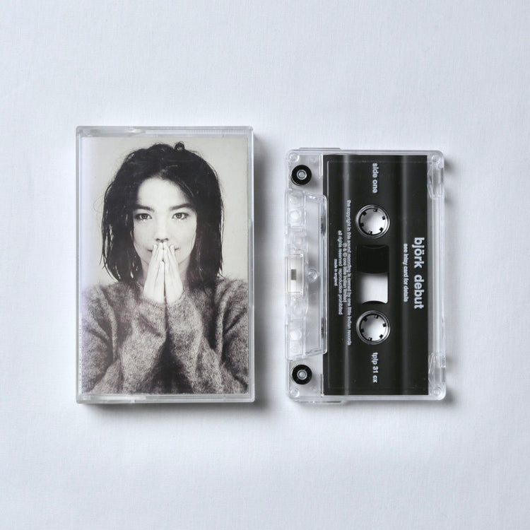 Cassette tape with Bjork's face on the cover against a white background