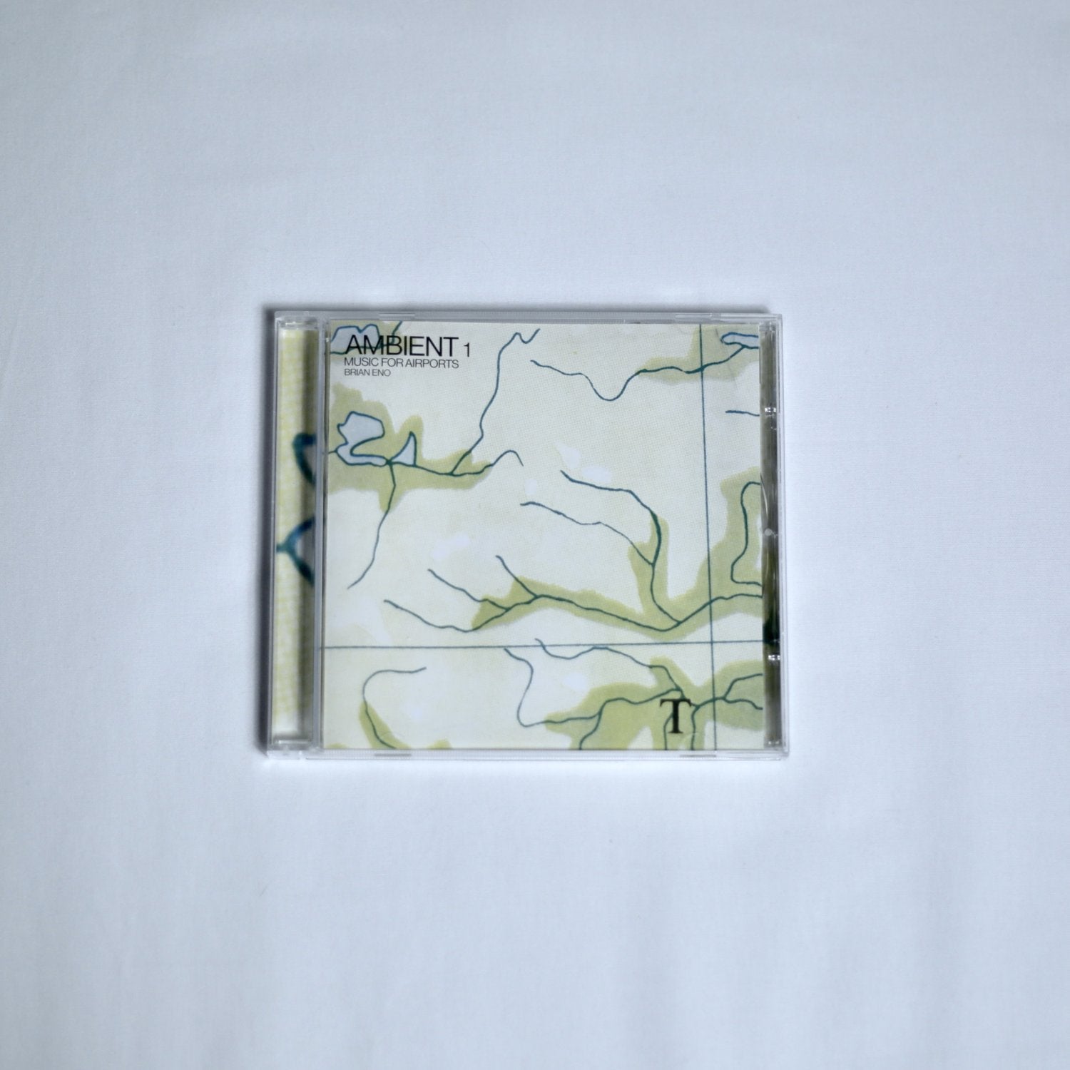 Brian Eno 'Ambient 1' music for airports CD on a white background
