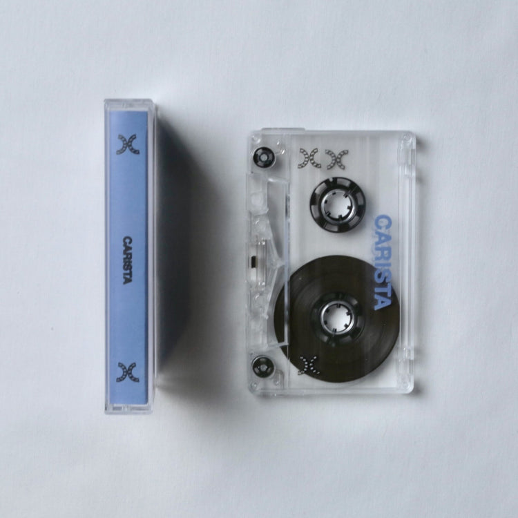 Carista cassette tape with clear casing and blue label on a light gray background