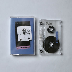 Carista cassette tape with a blue cover and visible branding on a light gray background