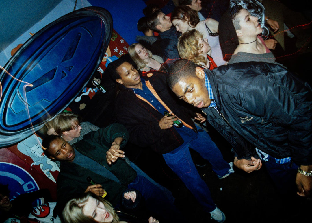 Group of people gathered in a nightclub.