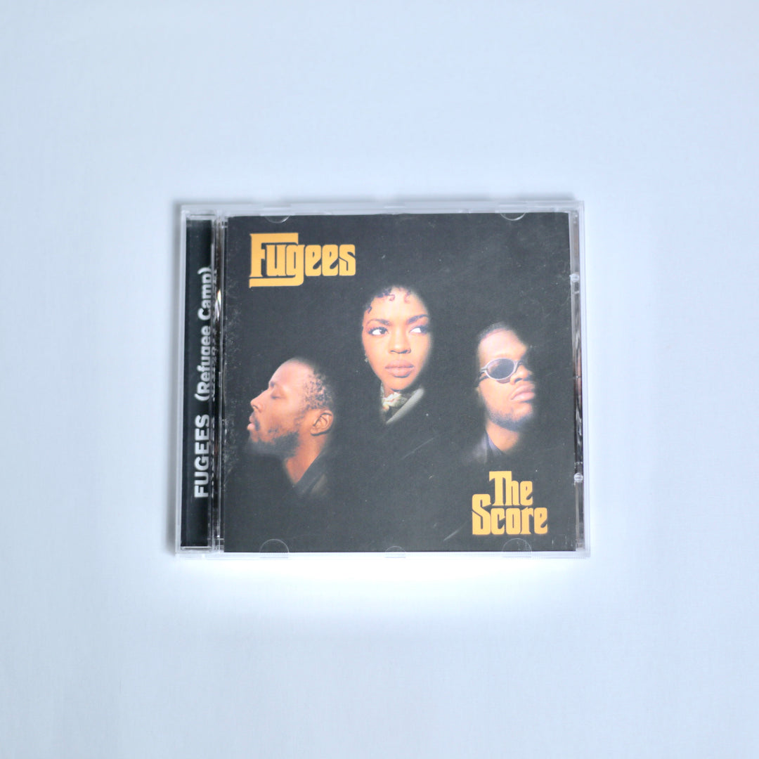 CD of Fugees the Score on off white background