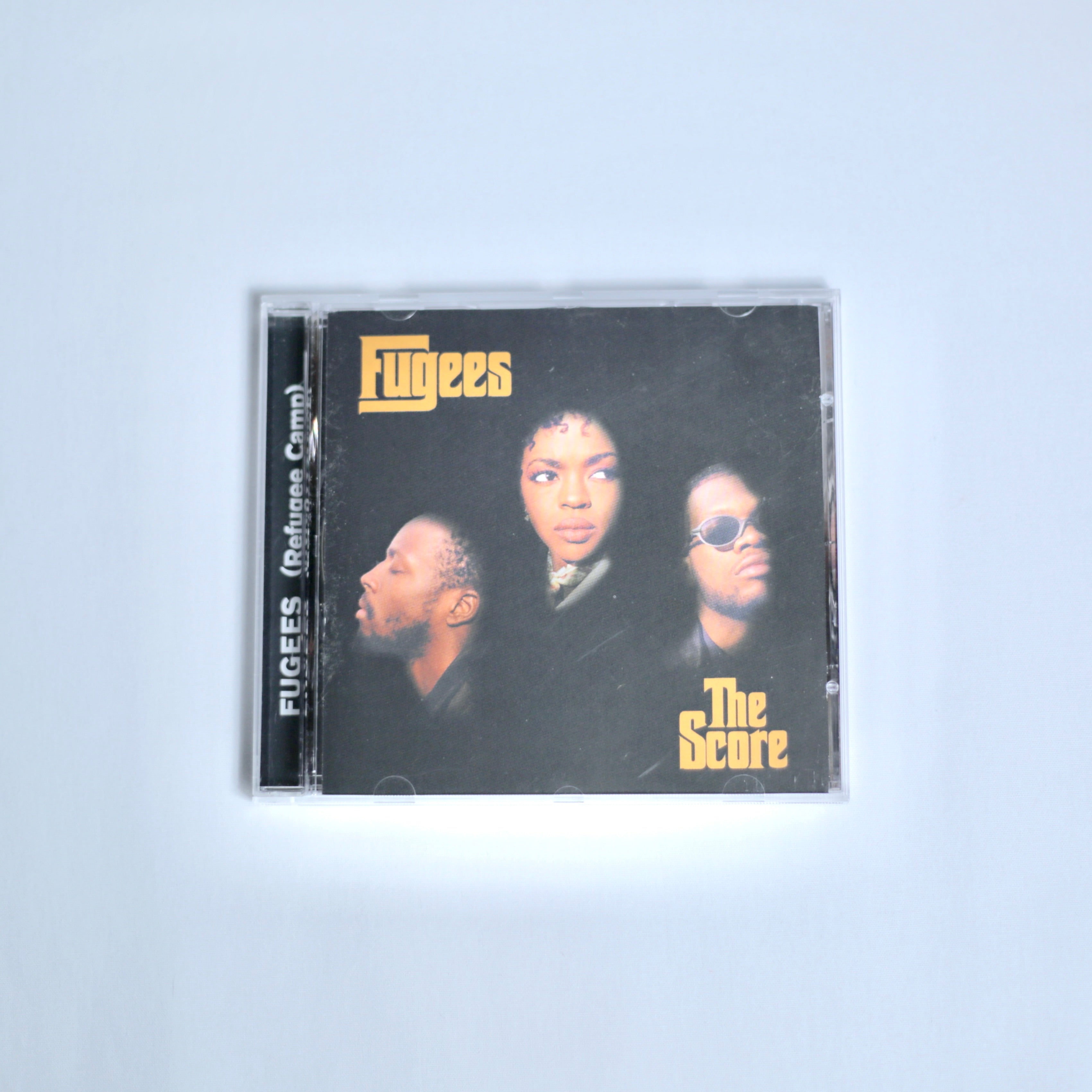 CD of Fugees the Score on off white background