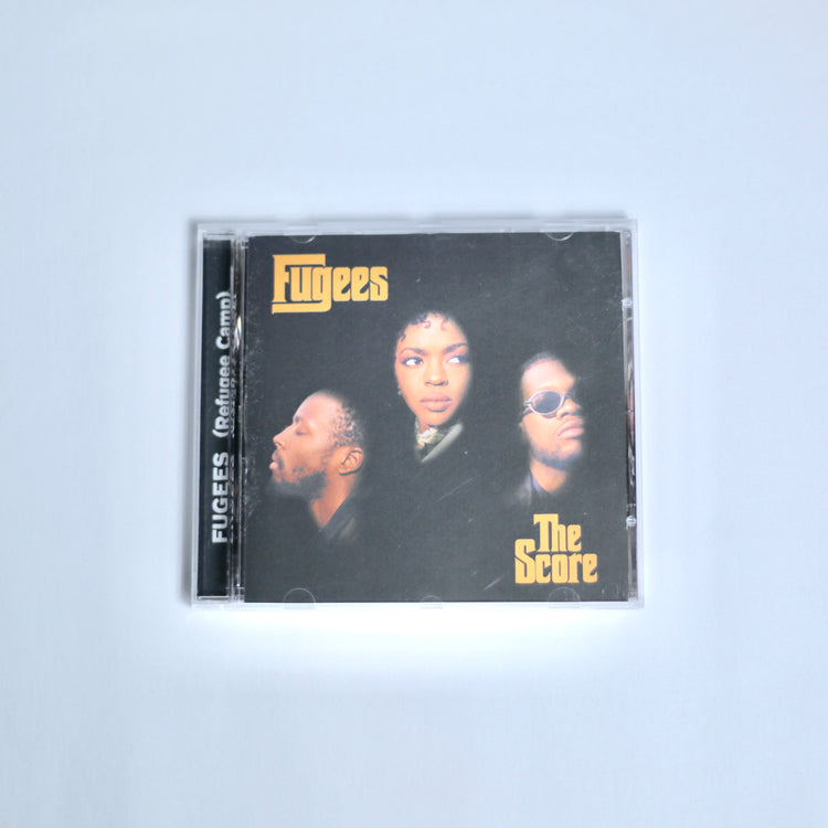 CD of Fugees the Score on off white background
