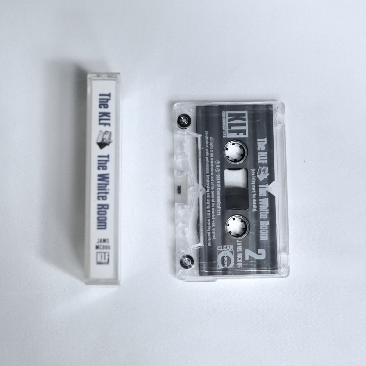The KLF – The White Room cassette, spine view of the inlay card next to the cassette (Side 2)
