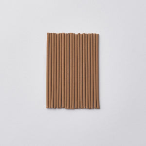 Incense on a light gray background