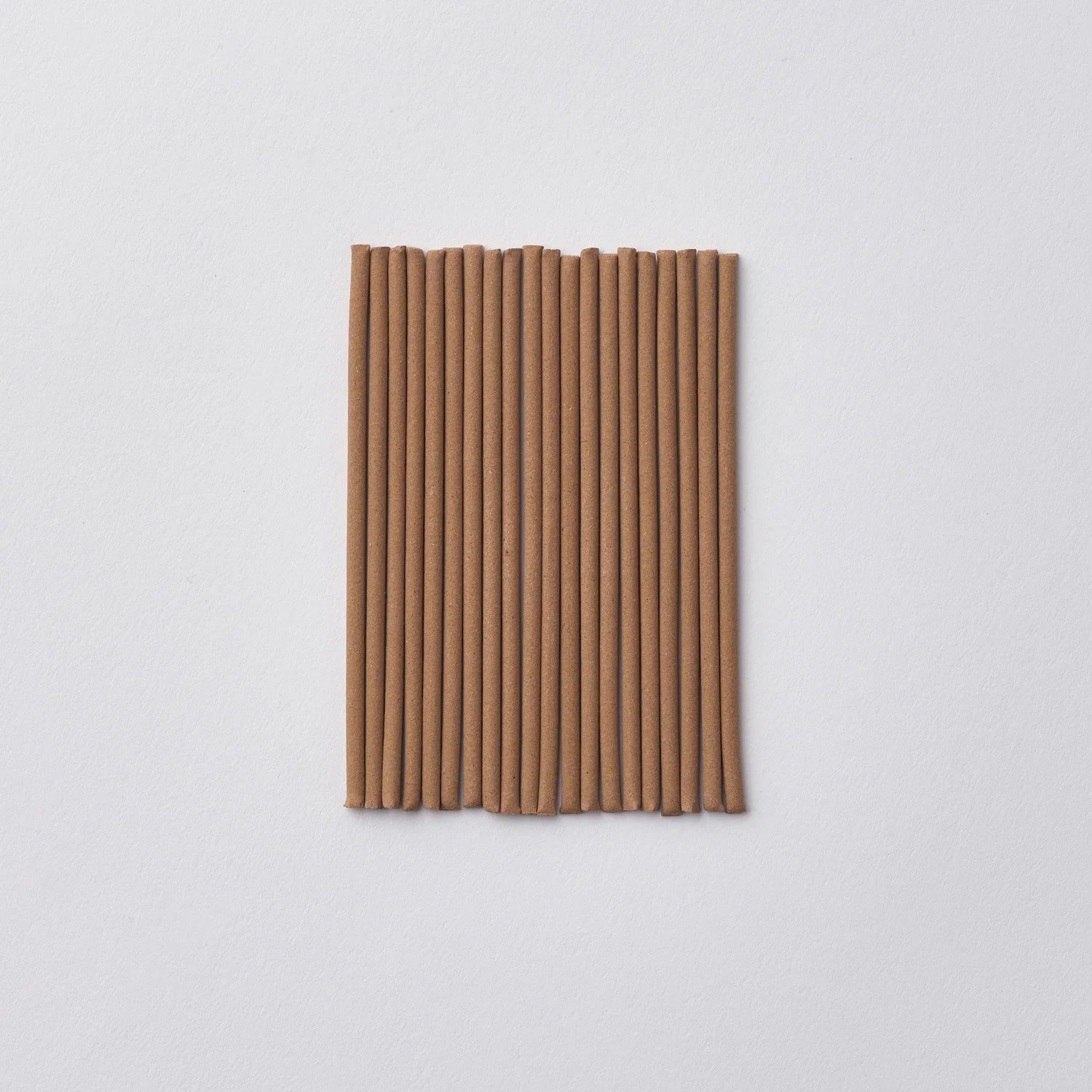 Incense on a light gray background