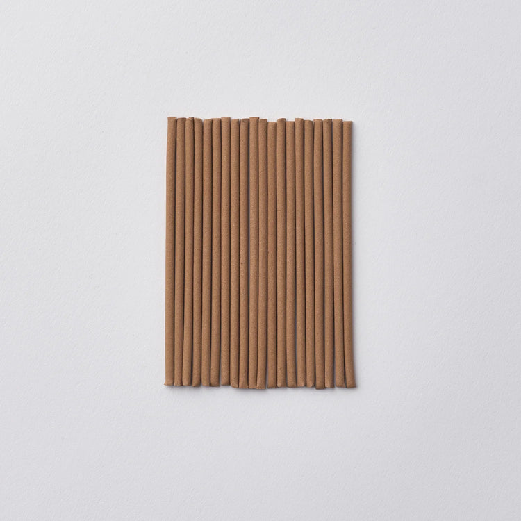 Incense on a light gray background
