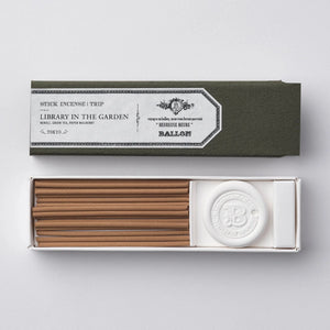 Incense sticks in a box with a visible brand label on a light gray background