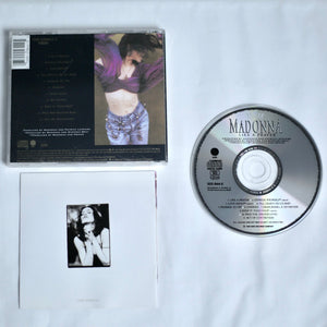 CD and cover of Madonna's 'Like a Prayer' album on a white background