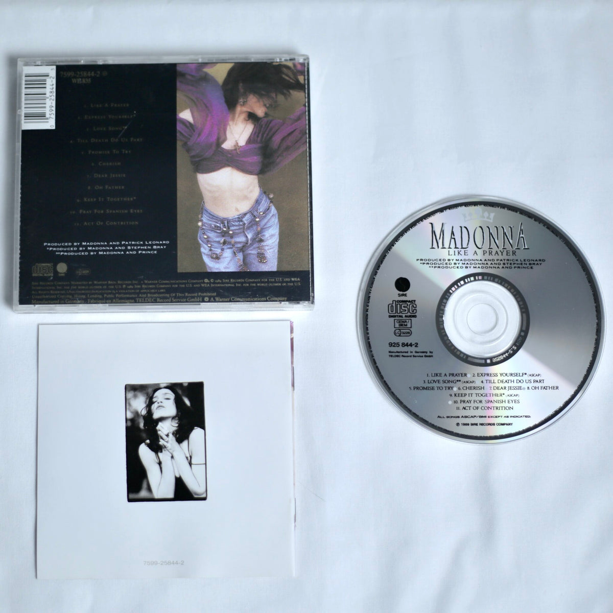 CD and cover of Madonna's 'Like a Prayer' album on a white background
