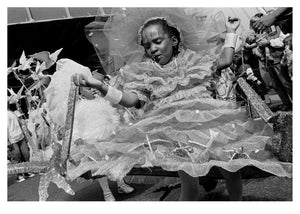 Girl in a decorative dress with intricate details, at Notting Hill Carnival