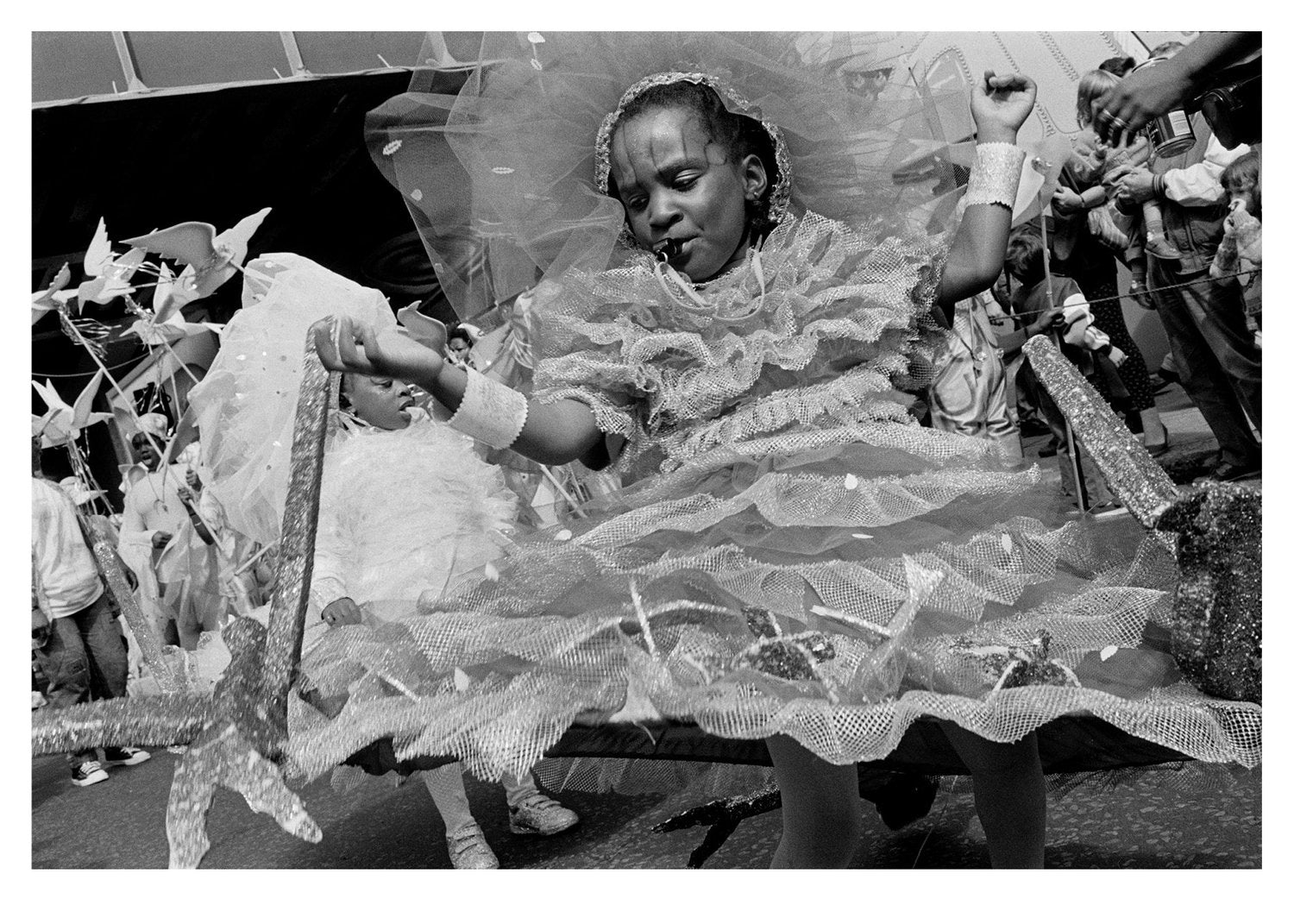Girl in a decorative dress with intricate details, at Notting Hill Carnival
