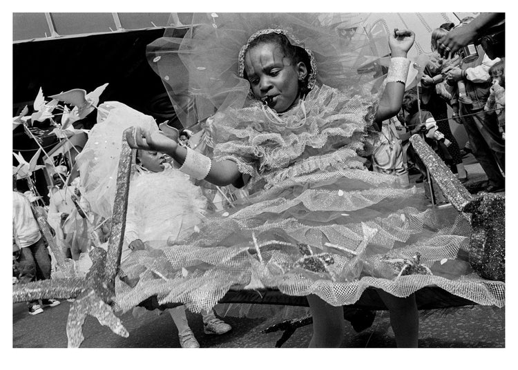 Girl in a decorative dress with intricate details, at Notting Hill Carnival