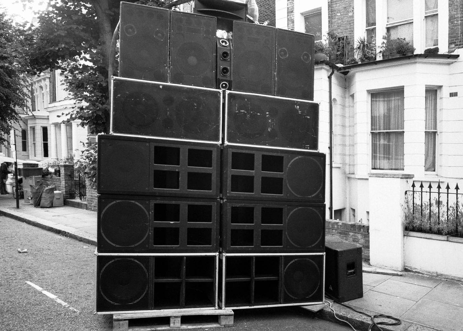 Sound System and stack of speakers on a Notting street with buildings in the background