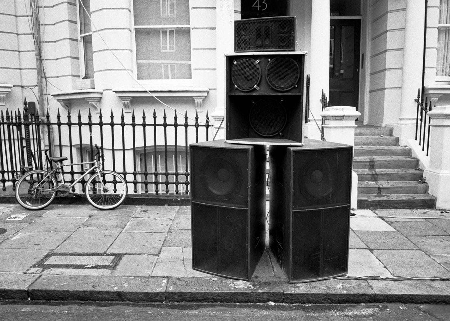 Large outdoor speakers on a Notting Hill street with a building in the background