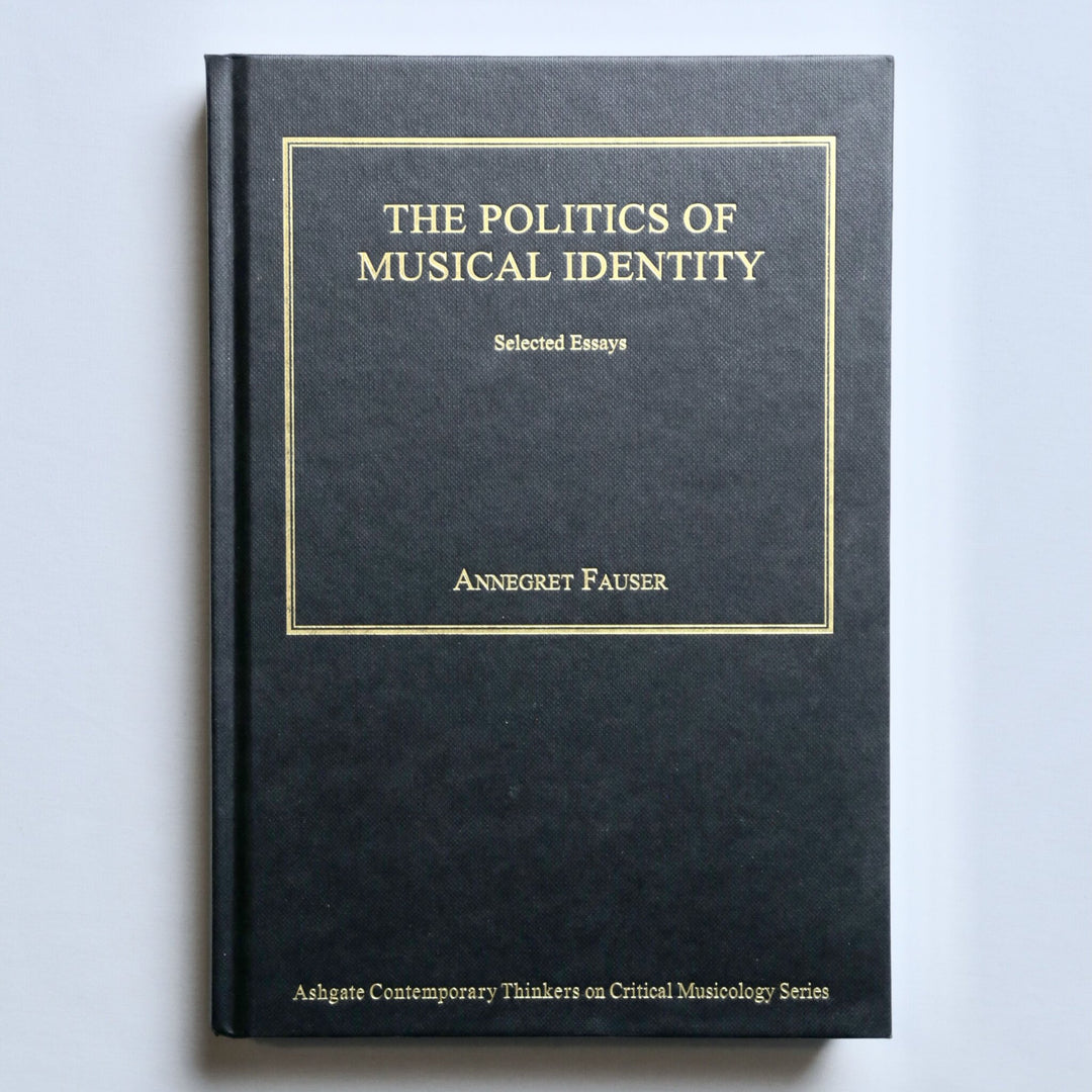 Book titled 'The Politics of Musical Identity' by Annegret Fauser on a light gray background
