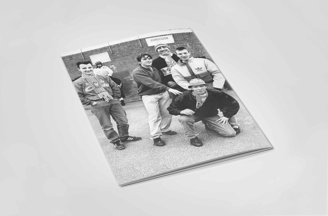 Book back cover in Black and white of a group of football fans.