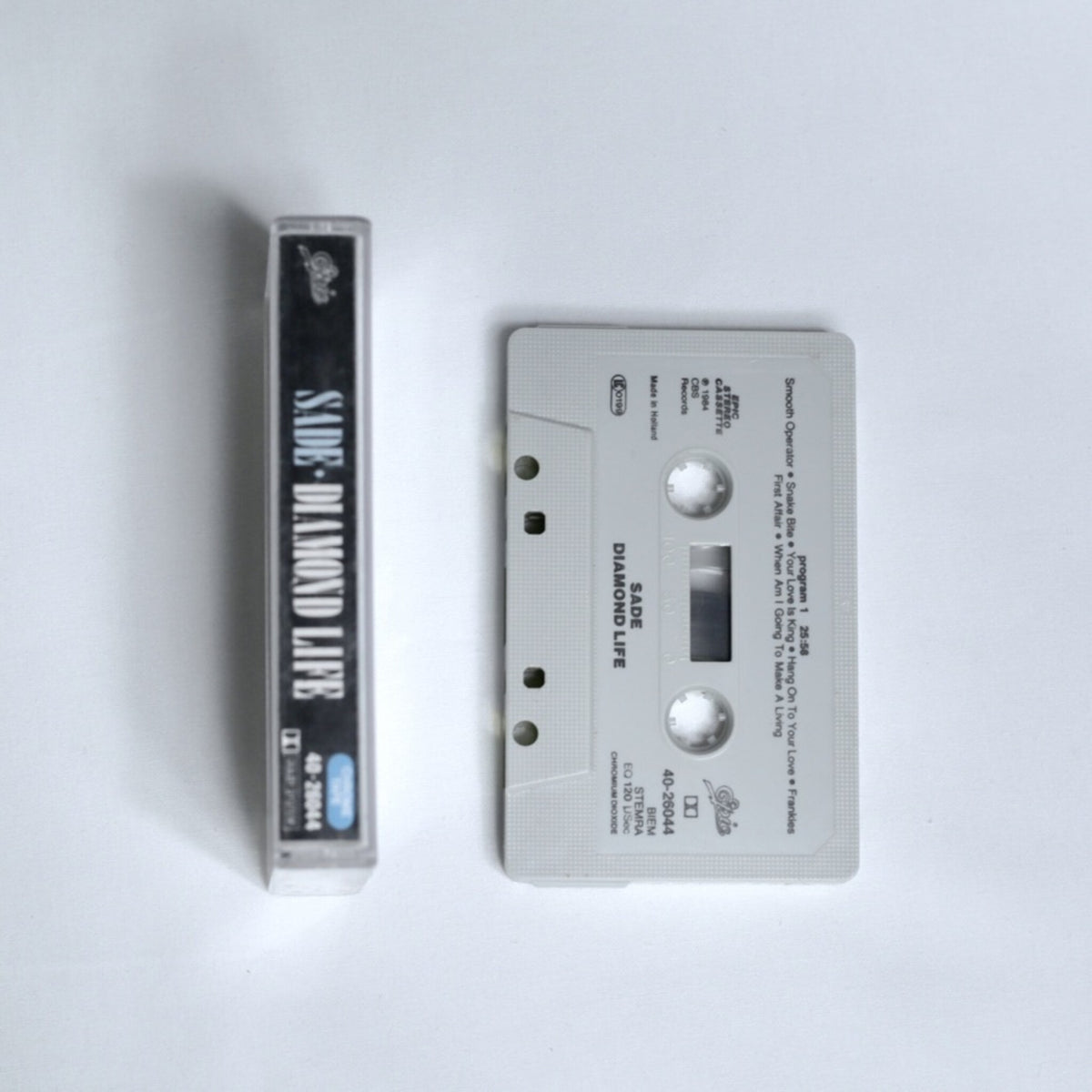 Sade – Diamond Life cassette tape spine, shown alongside the cassette 