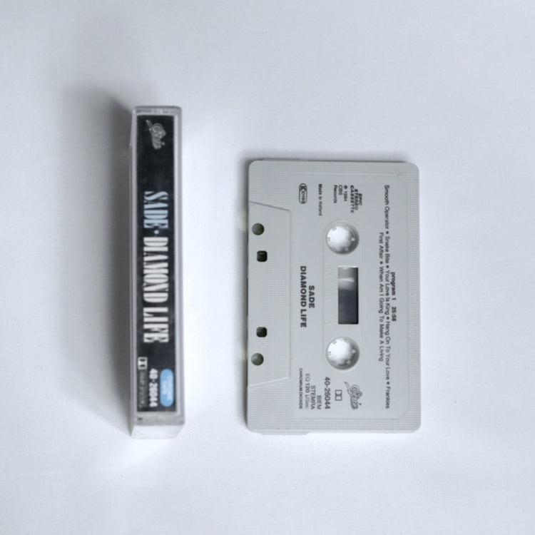 Sade – Diamond Life cassette tape spine, shown alongside the cassette 