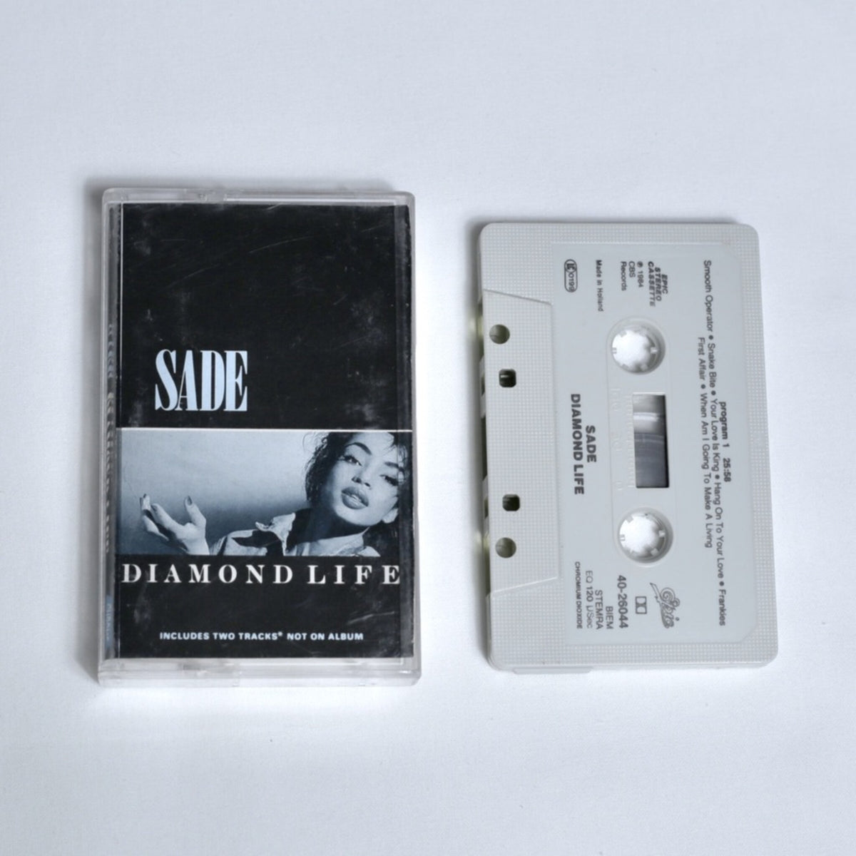 Sade – Diamond Life cassette tape, black and white cover photo of Sade, shown alongside the cassette 