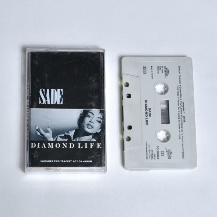 Sade – Diamond Life cassette tape, black and white cover photo of Sade, shown alongside the cassette 