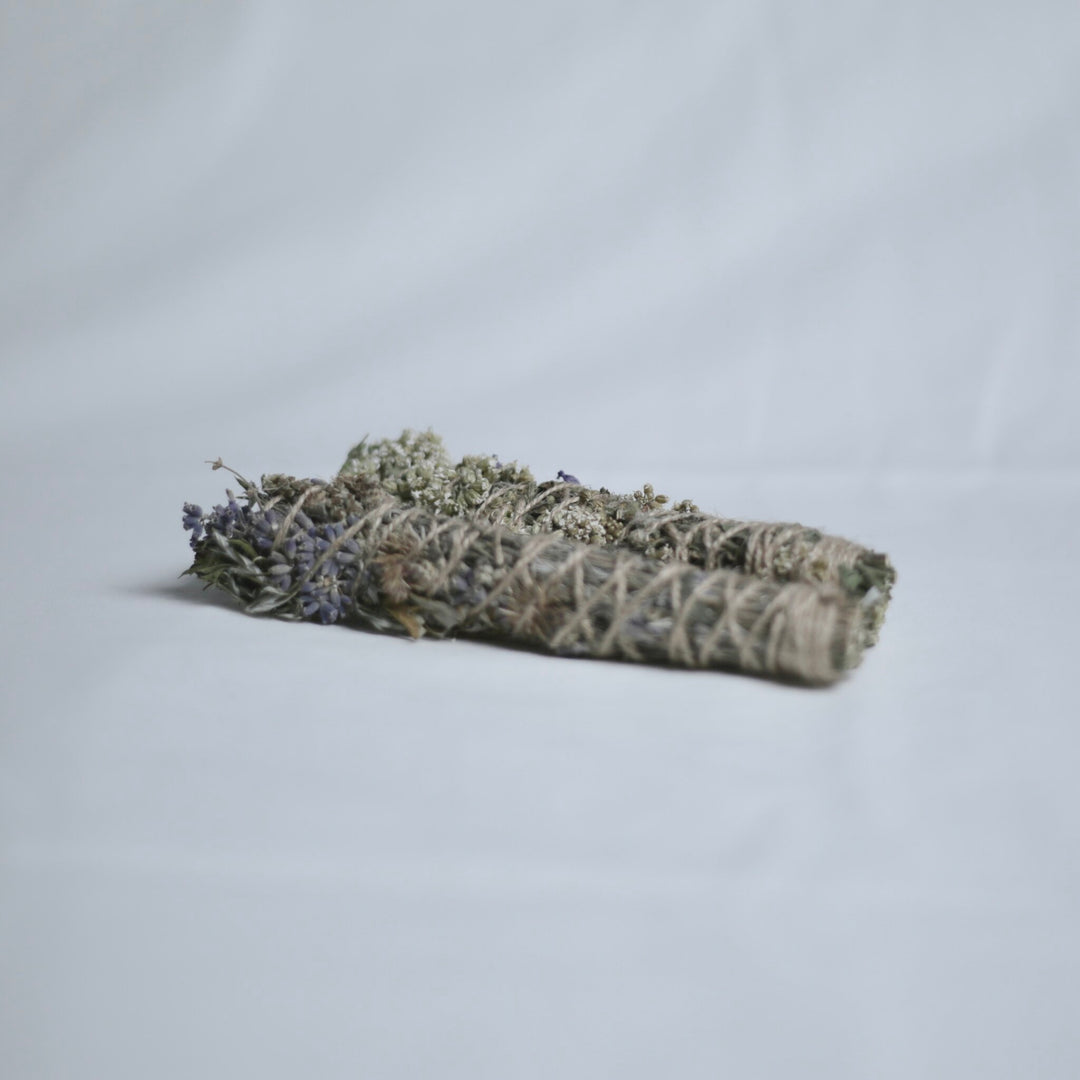 Two saining sticks on a light gray background