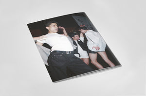 Back of book with a photograph of people dancing on a white background