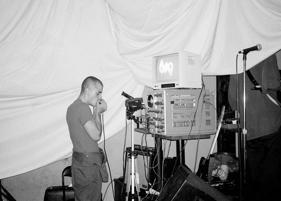 Person operating experimental electronic equipment in a warehouse setting