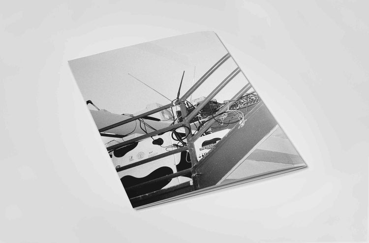 Back of Black and white photograph book with electronic music on an off white background