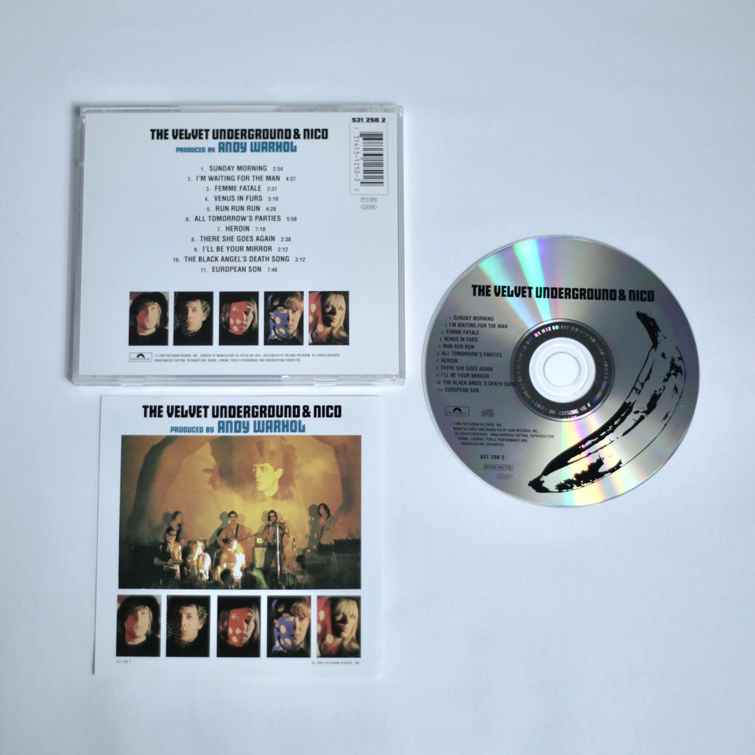 CD and cover of 'The Velvet Underground & Nico' with Andy Warhol's design on a white background